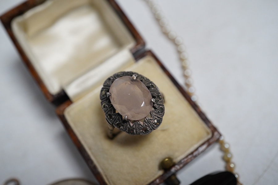 A marcasite ring, a pearl necklace, the garnet and split pearl clip, stamped 9ct, a black onyx and split pearl brooch and a 9ct gold photo pendant frame. Condition - fair